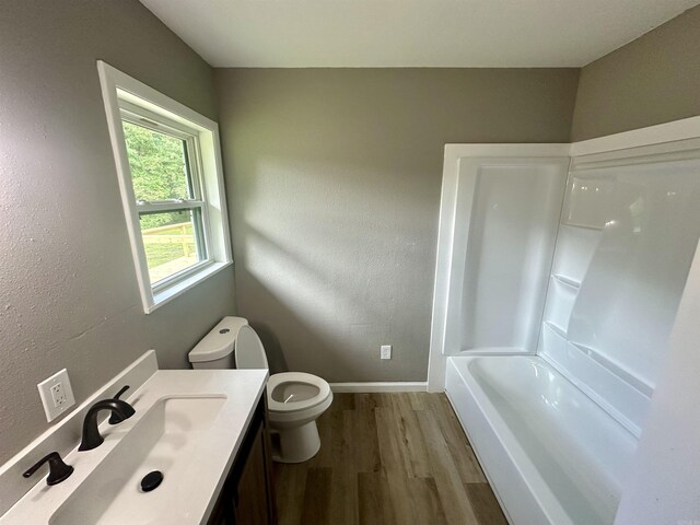 27 Grant 491 Rd, Sheridan, AR 72105 - bathroom with toilet, wood finished floors, baseboards, and vanity