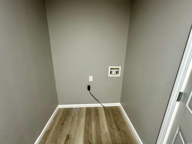 27 Grant 491 Rd, Sheridan, AR 72105 - laundry area featuring washer hookup, wood finished floors, and baseboards