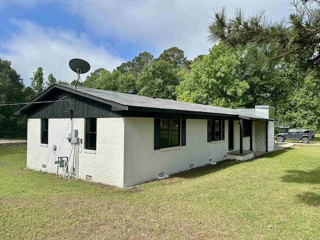 27 Grant 491 Rd, Sheridan, AR 72105 - view of home's exterior with crawl space, brick siding, and a yard