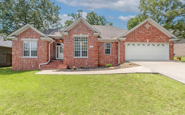 1010 Claycut Cir, North Little Rock, AR 72116 - view of front of property with an attached garage, concrete driveway, a front lawn, and brick siding