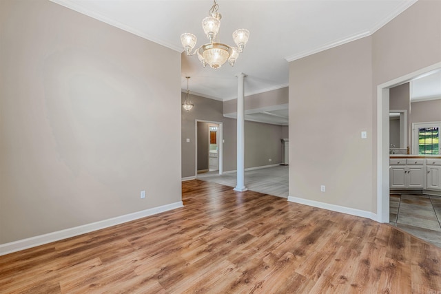 1010 Claycut Cir, North Little Rock, AR 72116 - unfurnished dining area with a chandelier, crown molding, light wood finished floors, and baseboards