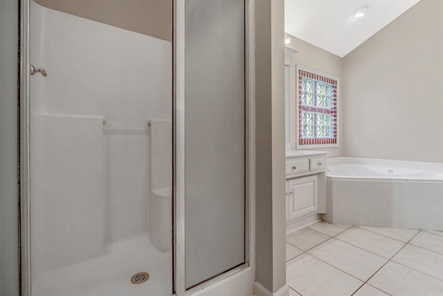 1010 Claycut Cir, North Little Rock, AR 72116 - full bath with a stall shower, a garden tub, tile patterned floors, vaulted ceiling, and vanity