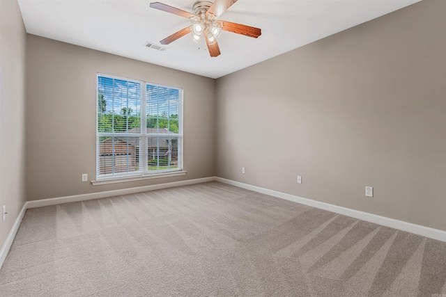 1010 Claycut Cir, North Little Rock, AR 72116 - spare room with baseboards, carpet floors, and a ceiling fan