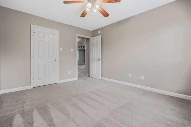 1010 Claycut Cir, North Little Rock, AR 72116 - unfurnished bedroom with light carpet, baseboards, and ceiling fan