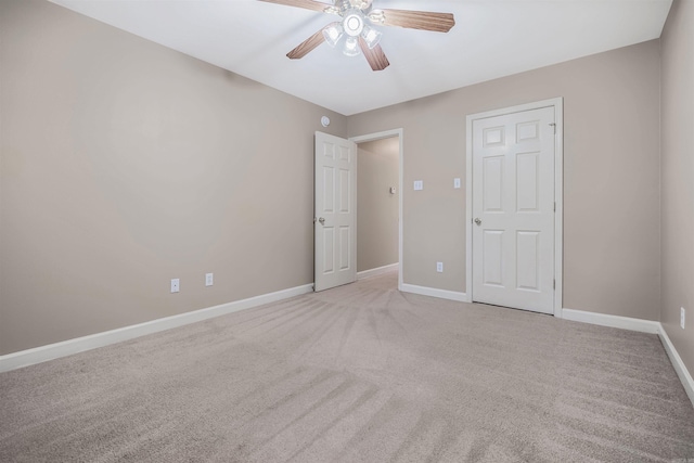 1010 Claycut Cir, North Little Rock, AR 72116 - unfurnished bedroom with light colored carpet, baseboards, and ceiling fan