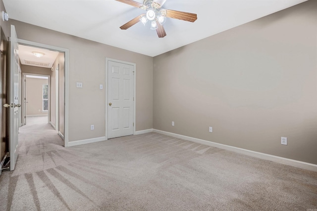1010 Claycut Cir, North Little Rock, AR 72116 - unfurnished room featuring ceiling fan, light colored carpet, baseboards, and attic access