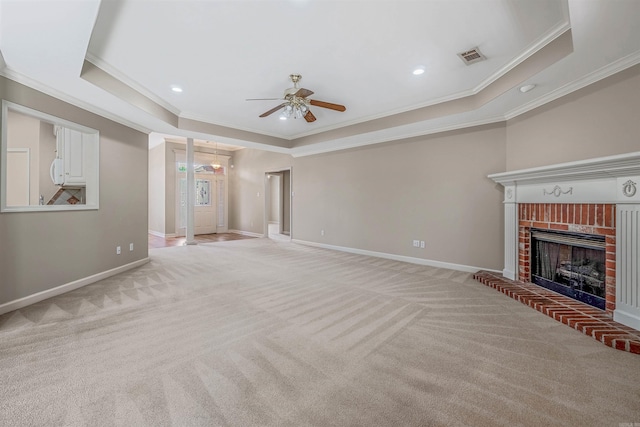 1010 Claycut Cir, North Little Rock, AR 72116 - unfurnished living room featuring ornamental molding, a raised ceiling, light colored carpet, ceiling fan, and baseboards