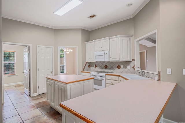 1010 Claycut Cir, North Little Rock, AR 72116 - kitchen featuring white appliances, a sink, backsplash, healthy amount of natural light, and ornamental molding