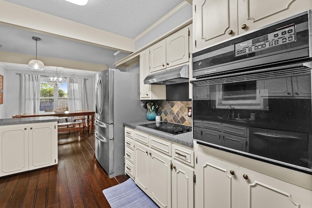 42 Desoto Cir, North Little Rock, AR 72116 - kitchen with under cabinet range hood, black appliances, backsplash, a chandelier, and white cabinets