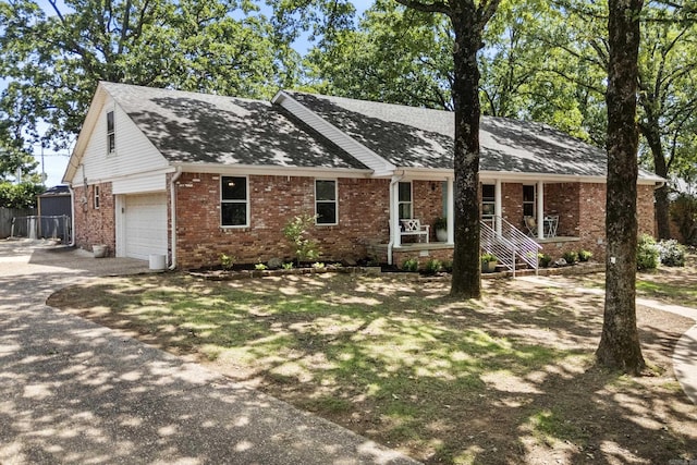 42 Desoto Cir, North Little Rock, AR 72116 - ranch-style house with driveway, brick siding, and roof with shingles