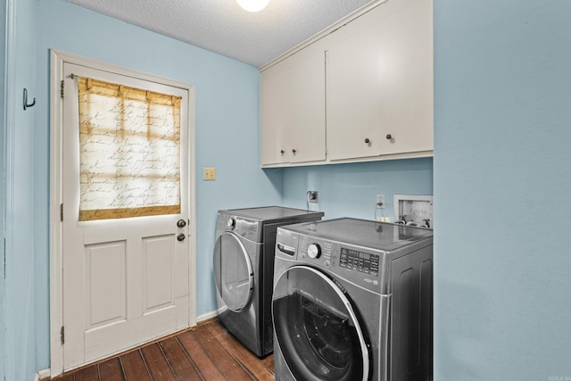 42 Desoto Cir, North Little Rock, AR 72116 - laundry room featuring cabinet space, dark wood-style floors, washer and dryer, a textured ceiling, and baseboards