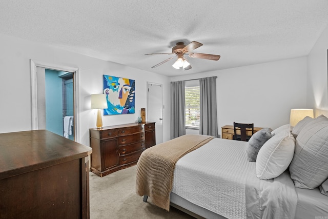 42 Desoto Cir, North Little Rock, AR 72116 - bedroom with light colored carpet, ceiling fan, and a textured ceiling