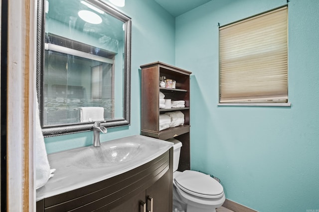 42 Desoto Cir, North Little Rock, AR 72116 - bathroom featuring toilet, vanity, and baseboards