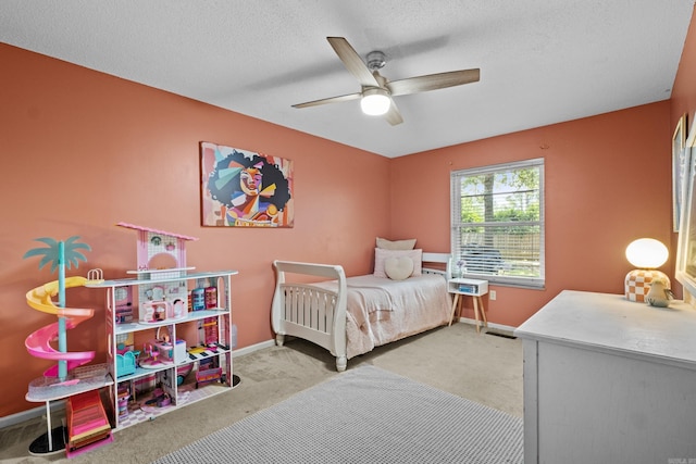 42 Desoto Cir, North Little Rock, AR 72116 - bedroom with carpet, baseboards, a ceiling fan, and a textured ceiling
