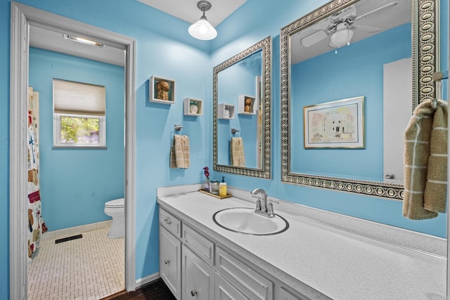 42 Desoto Cir, North Little Rock, AR 72116 - full bathroom featuring vanity, toilet, a ceiling fan, and baseboards
