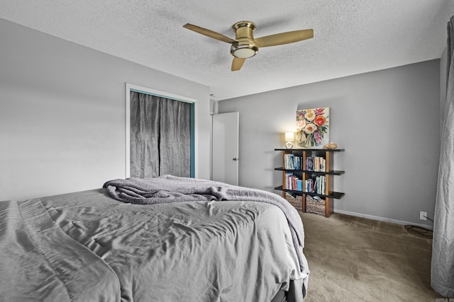 42 Desoto Cir, North Little Rock, AR 72116 - carpeted bedroom featuring ceiling fan, a textured ceiling, a closet, and baseboards