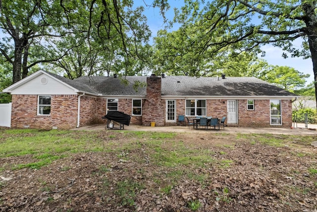 42 Desoto Cir, North Little Rock, AR 72116 - rear view of property featuring a patio area, brick siding, a chimney, and fence