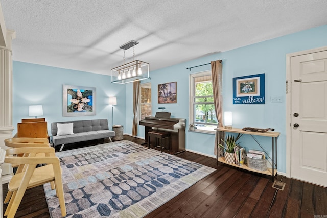 42 Desoto Cir, North Little Rock, AR 72116 - living room featuring hardwood / wood-style floors, a textured ceiling, and baseboards