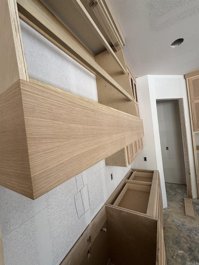 143 Kinley Loop, Little Rock, AR 72223 - kitchen featuring open shelves and a textured ceiling