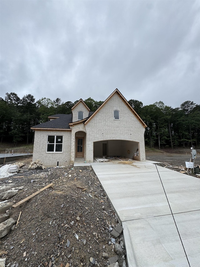 143 Kinley Loop, Little Rock, AR 72223 - french provincial home with concrete driveway and a garage