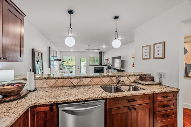 2510 Riverfront # 2, Little Rock, AR 72202 - kitchen featuring dishwasher, a sink, a peninsula, and hanging light fixtures