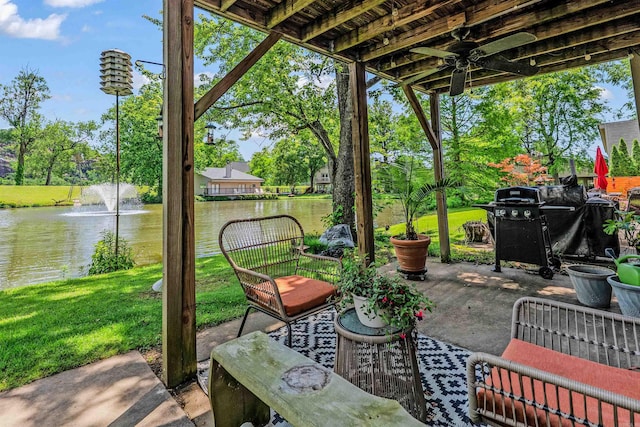 2510 Riverfront # 2, Little Rock, AR 72202 - view of patio / terrace with a water view, a grill, and view of wooded area