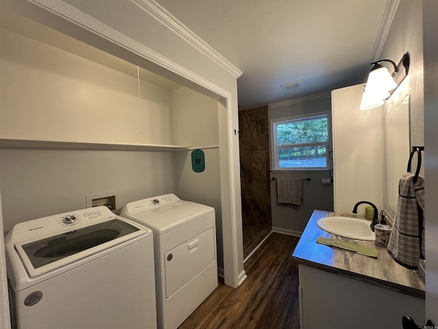1906 Fernwood Cv, Benton, AR 72015 - laundry room featuring washer and clothes dryer, dark wood-style floors, ornamental molding, and baseboards