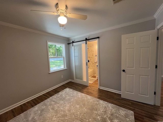 1906 Fernwood Cv, Benton, AR 72015 - unfurnished bedroom with dark wood-style flooring, baseboards, ornamental molding, a barn door, and ensuite bath