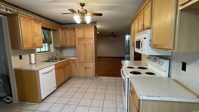 1410 Rock Creek Dr, Benton, AR 72019 - kitchen featuring white appliances, a sink, ceiling fan, light countertops, and a textured ceiling
