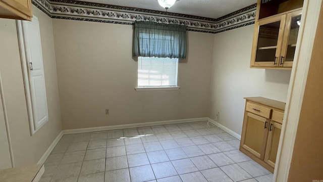 1410 Rock Creek Dr, Benton, AR 72019 - unfurnished dining area with light tile patterned flooring and baseboards