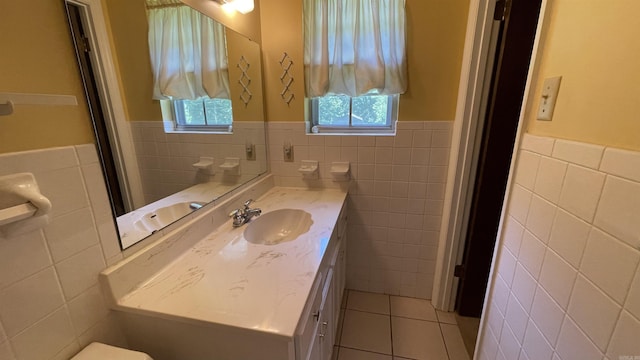 1410 Rock Creek Dr, Benton, AR 72019 - bathroom featuring tile walls, tile patterned floors, a wainscoted wall, and vanity