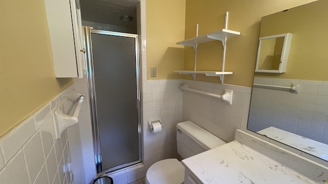 1410 Rock Creek Dr, Benton, AR 72019 - full bath featuring tile walls, a wainscoted wall, a stall shower, and toilet