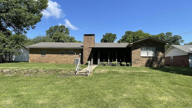 1410 Rock Creek Dr, Benton, AR 72019 - back of house with a chimney, brick siding, and a yard