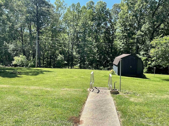 1410 Rock Creek Dr, Benton, AR 72019 - view of green lawn featuring a storage unit and an outdoor structure
