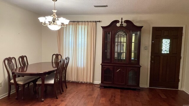 1410 Rock Creek Dr, Benton, AR 72019 - dining room with a chandelier, wood finished floors, and baseboards