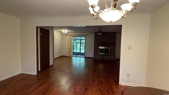 1410 Rock Creek Dr, Benton, AR 72019 - unfurnished living room featuring dark wood finished floors, a chandelier, a fireplace, and baseboards