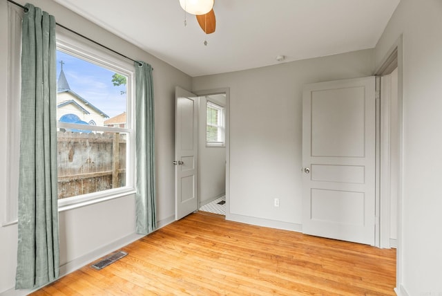 1724 W 19, Little Rock, AR 72202 - unfurnished room with healthy amount of natural light, light wood finished floors, and baseboards