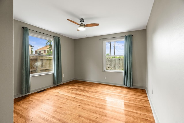 1724 W 19, Little Rock, AR 72202 - spare room featuring plenty of natural light, light wood finished floors, a ceiling fan, and baseboards