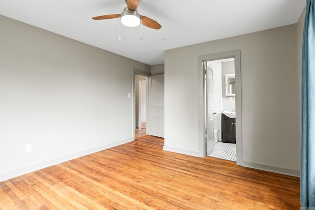 1724 W 19, Little Rock, AR 72202 - unfurnished bedroom featuring light wood finished floors, baseboards, ensuite bath, and a ceiling fan