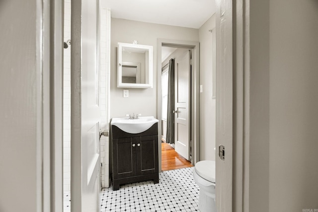 1724 W 19, Little Rock, AR 72202 - bathroom with vanity, toilet, and tile patterned floors