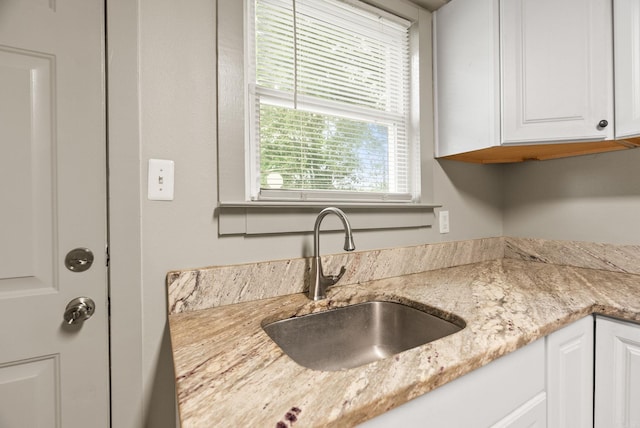 1724 W 19, Little Rock, AR 72202 - kitchen view of a sink, white cabinetry, and light stone countertops