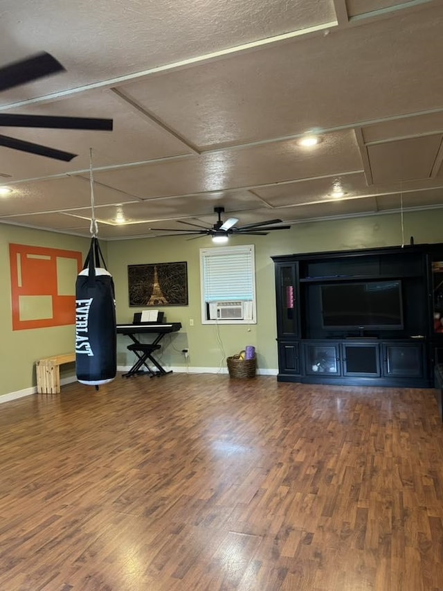 5490 Greene 628 Rd, Paragould, AR 72450 - living room featuring wood finished floors, a ceiling fan, cooling unit, baseboards, and attic access