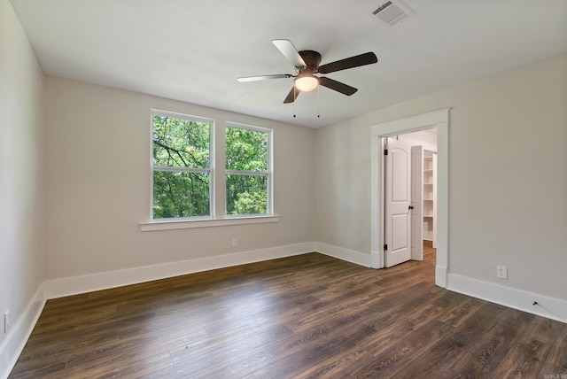 4300 W 16th St, Little Rock, AR 72204 - unfurnished room with dark wood-style floors, baseboards, and a ceiling fan