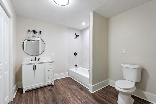 4300 W 16th St, Little Rock, AR 72204 - full bathroom featuring baseboards, wood finished floors, toilet, vanity, and shower / tub combination
