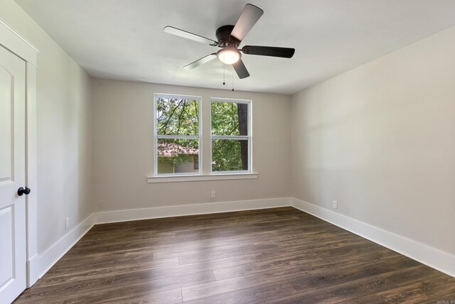 4300 W 16th St, Little Rock, AR 72204 - unfurnished room with dark wood-style flooring, a ceiling fan, and baseboards