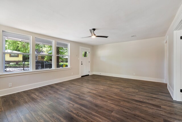 4300 W 16th St, Little Rock, AR 72204 - spare room with plenty of natural light, dark wood-style floors, baseboards, and a ceiling fan
