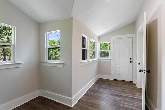 4300 W 16th St, Little Rock, AR 72204 - doorway featuring vaulted ceiling, dark wood-style floors, and baseboards