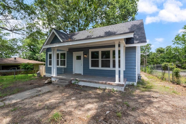 4300 W 16th St, Little Rock, AR 72204 - view of front facade with covered porch, fence, and a shingled roof