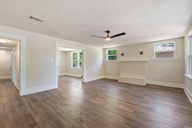 4300 W 16th St, Little Rock, AR 72204 - spare room featuring a ceiling fan, dark wood-style floors, and baseboards