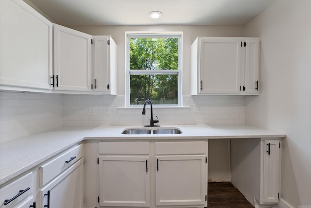 4300 W 16th St, Little Rock, AR 72204 - kitchen with a sink, white cabinetry, and tasteful backsplash